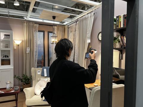 student photographing IKEA bedroom